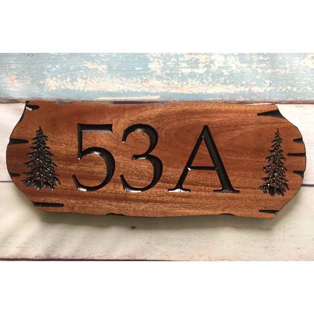 Wooden address sign with large carved numbers
